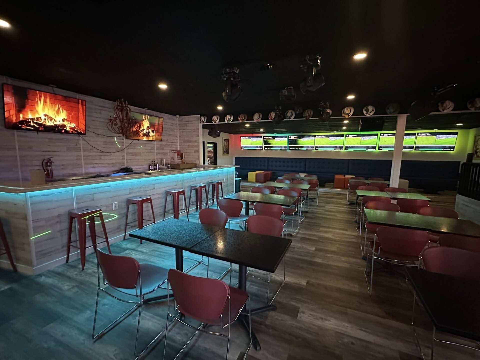The Lounge bar with blue LED trim and red chairs