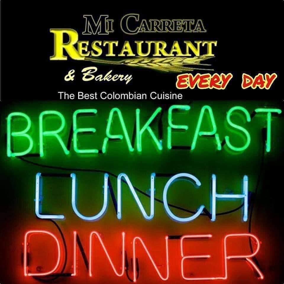 The neon window sign: Breakfast, Lunch, Dinner, every day