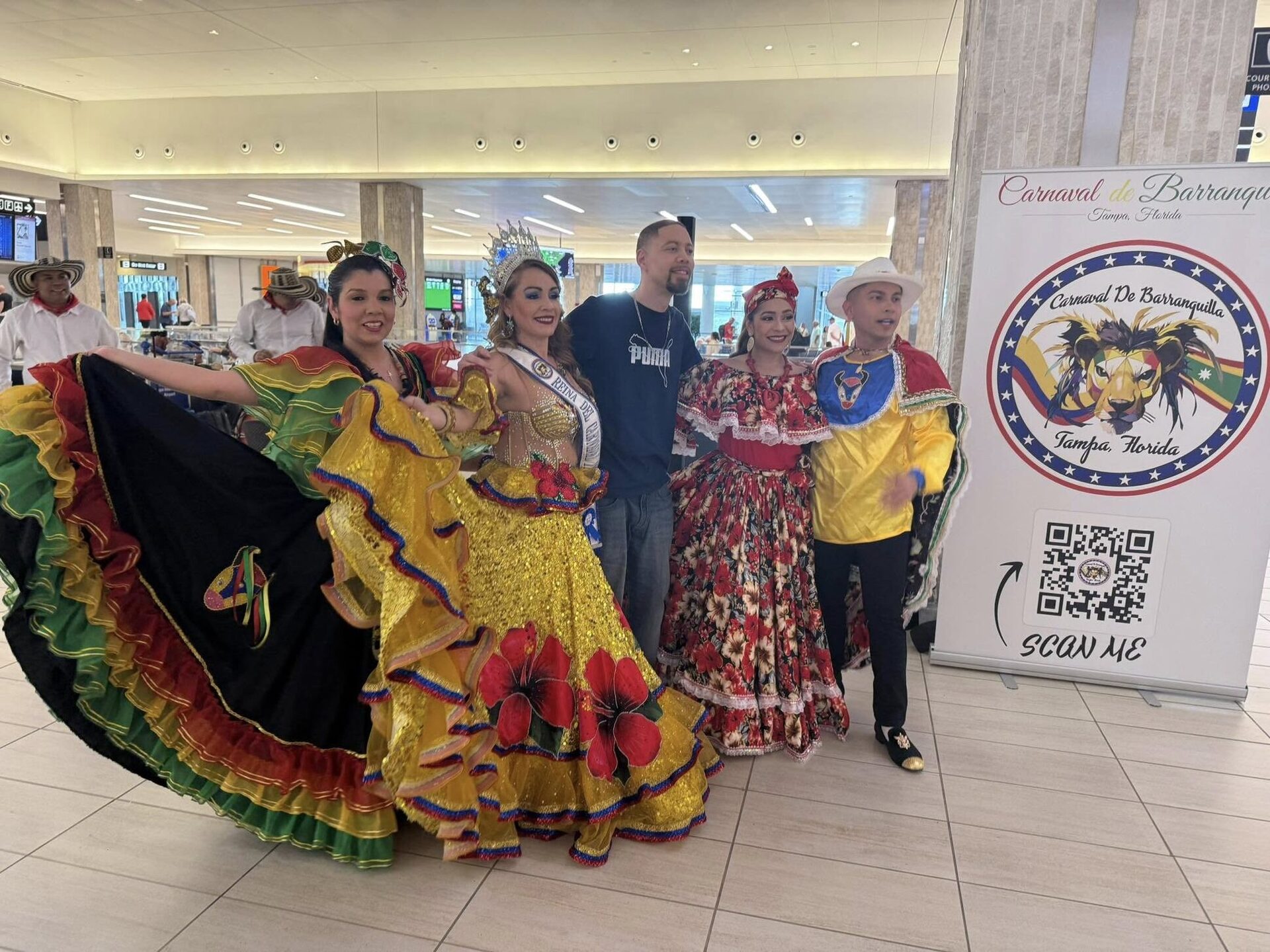 Folk dancers in Carnaval de Barranquilla dress at a Tampa event