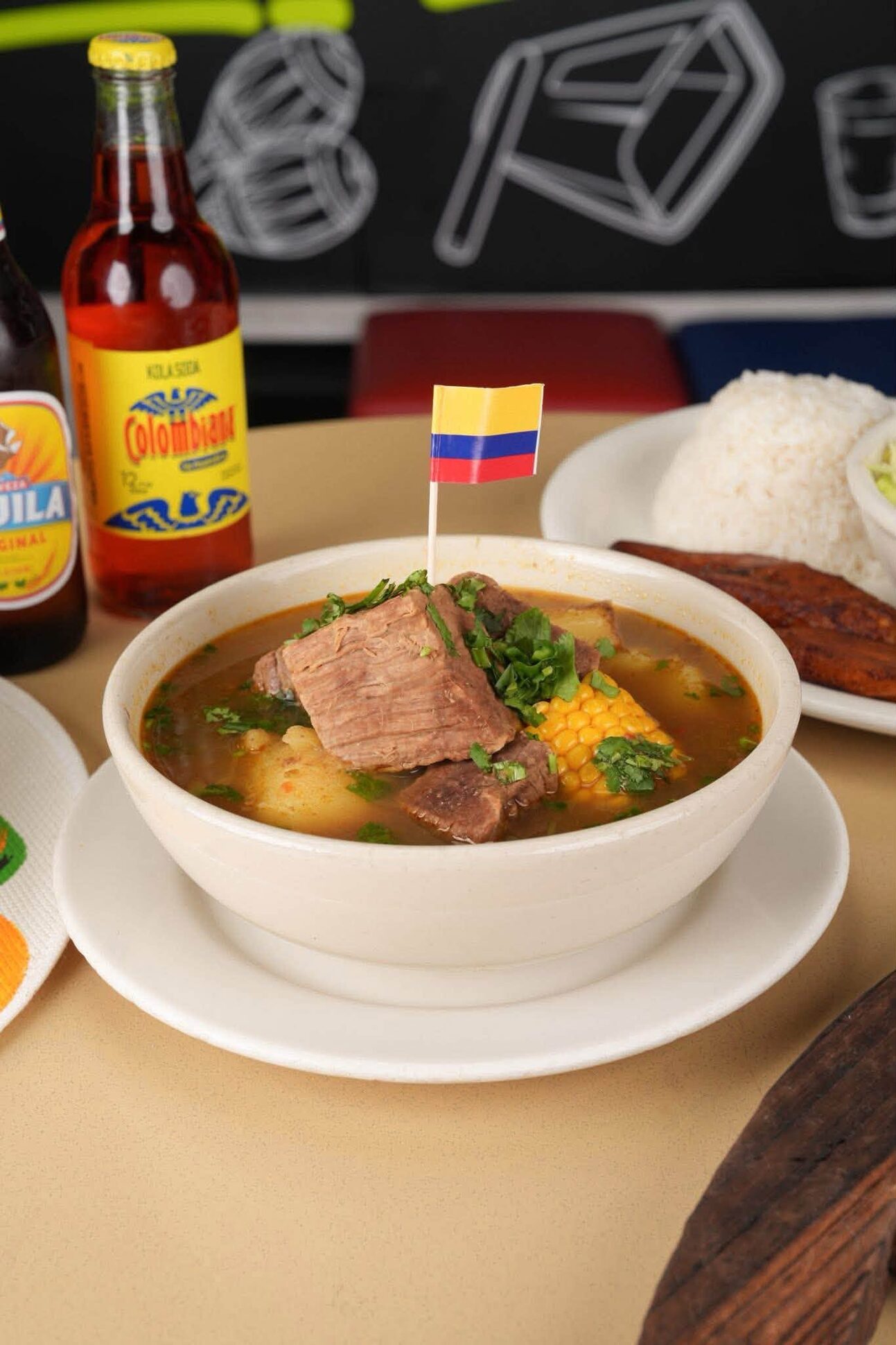 A bowl of sancocho with beef rib and corn