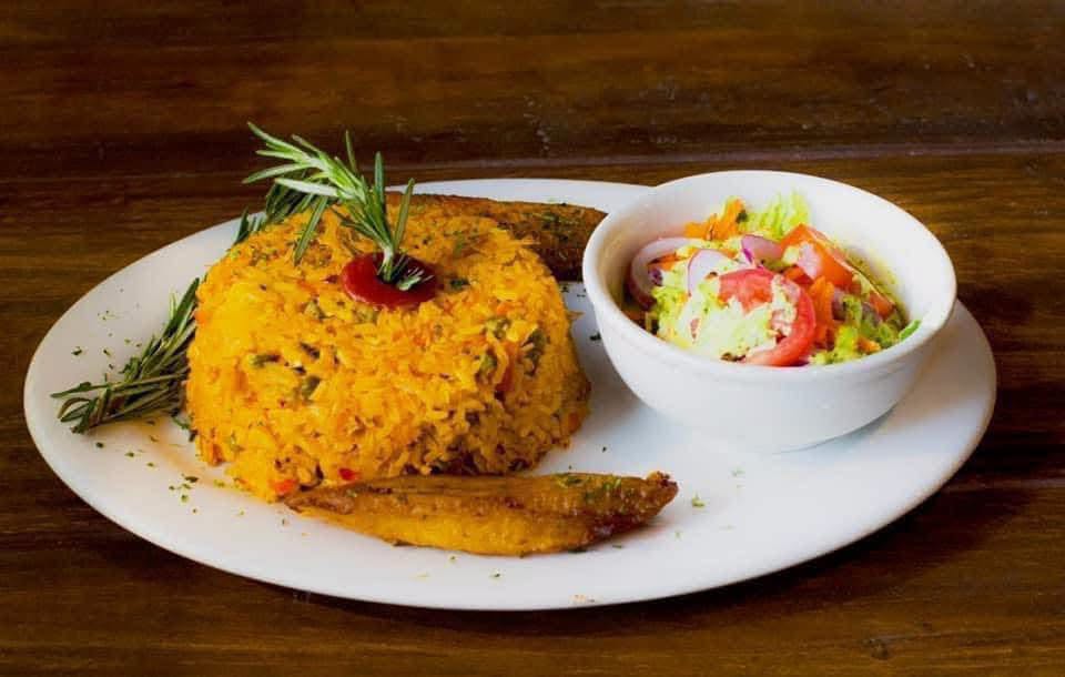 Seafood rice shaped into a dome with a small salad