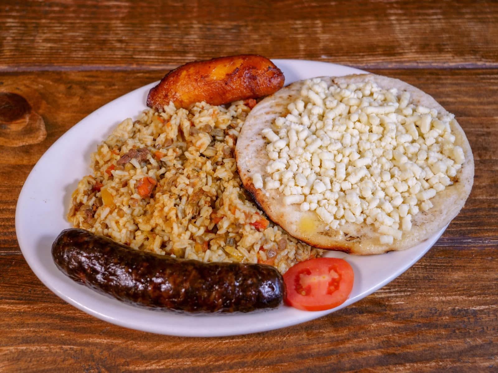 Calentado with Colombian sausage, a white corn arepa and sweet plantain