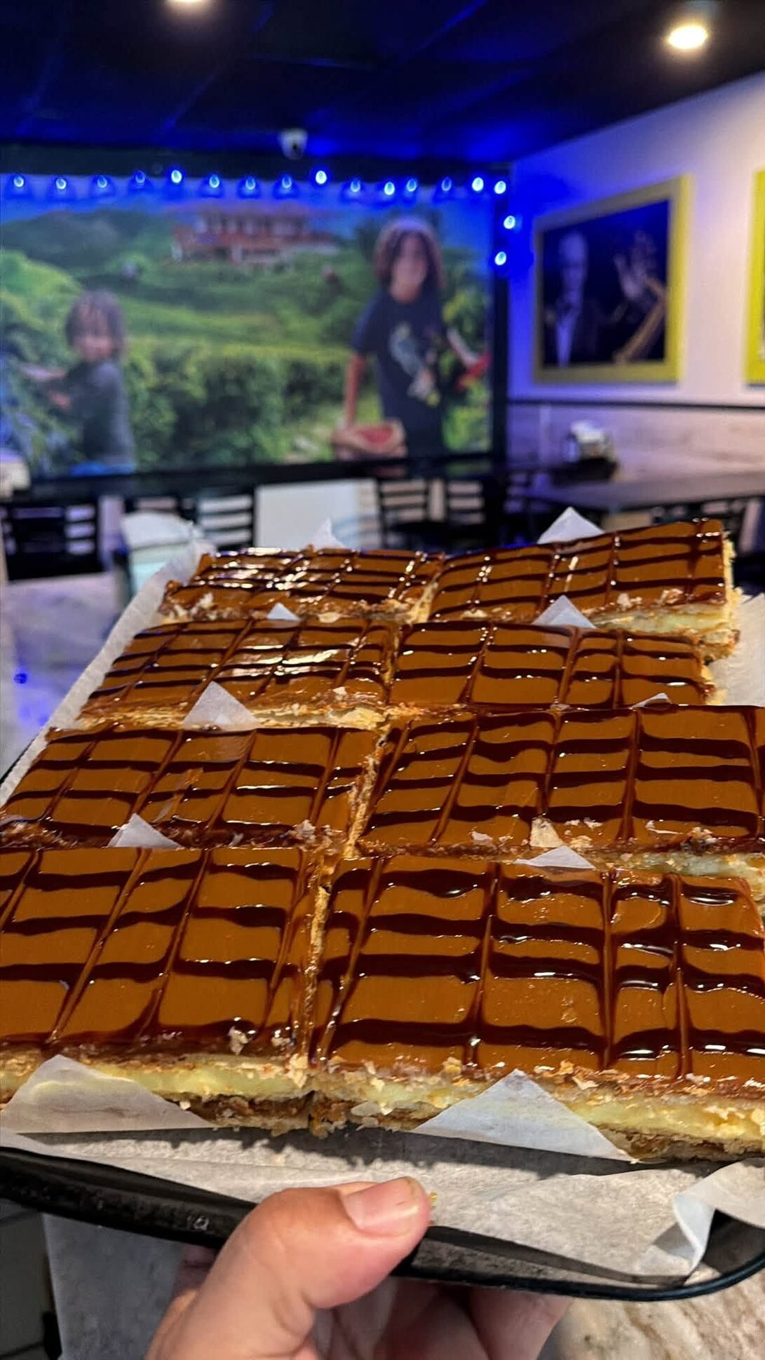 A tray of milhojas held up in the dining room