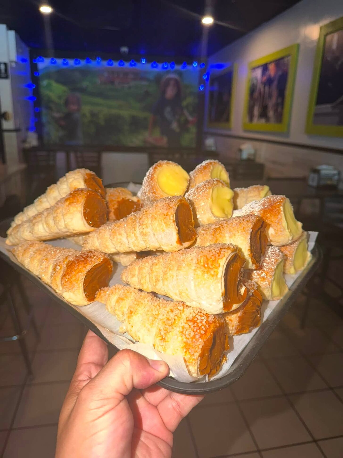 A tray of cream cones held up in the dining room