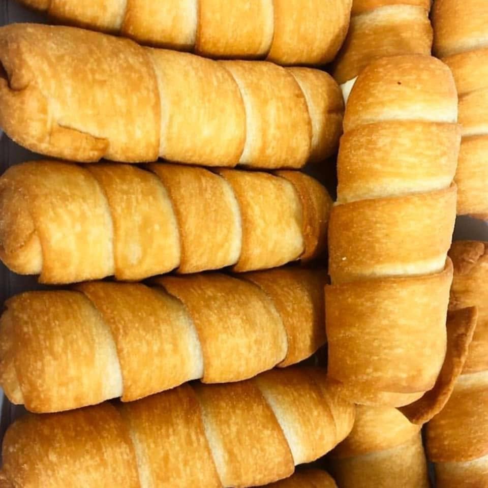 Stacked flaky cream-cone pastries