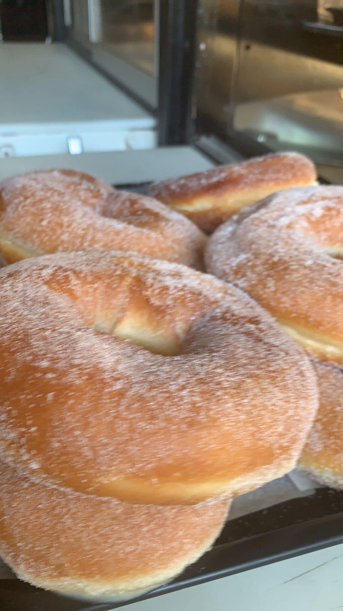 Sugar-dusted pastries in the case